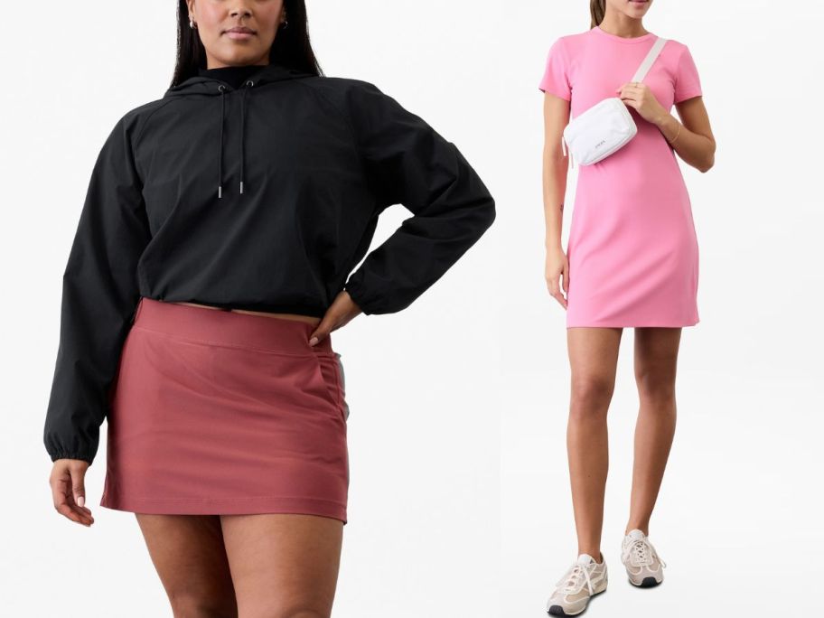 woman wearing black sweatshirt and red skirt and woman wearing pink dress