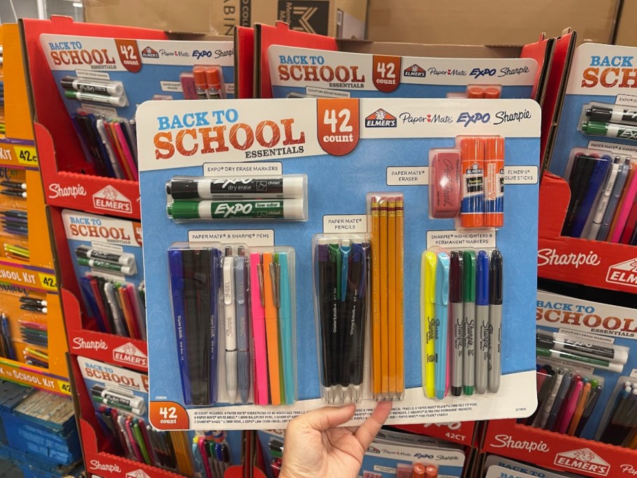 hand holding a back to school essentials kit