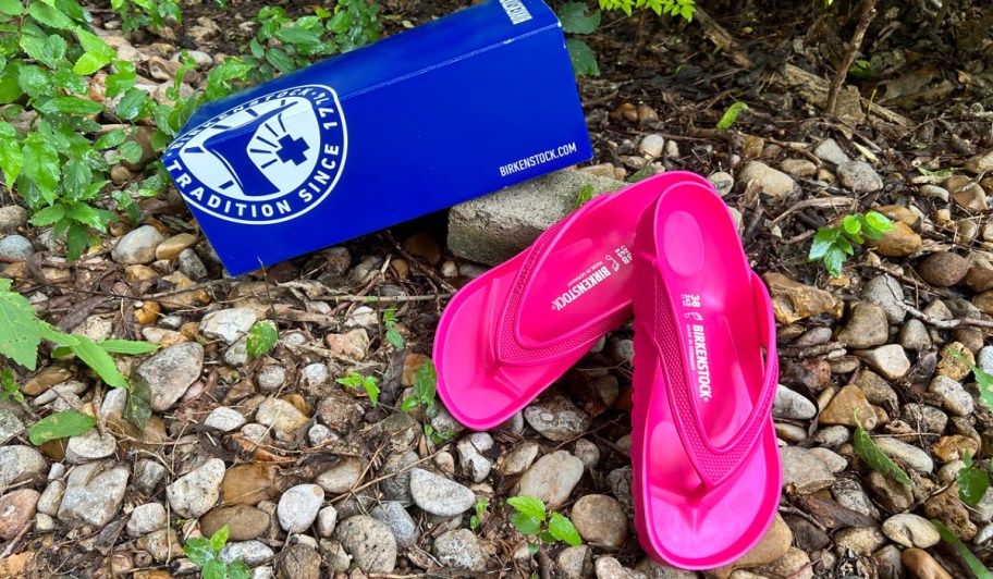 birkenstock pink sandals next to a shoe box