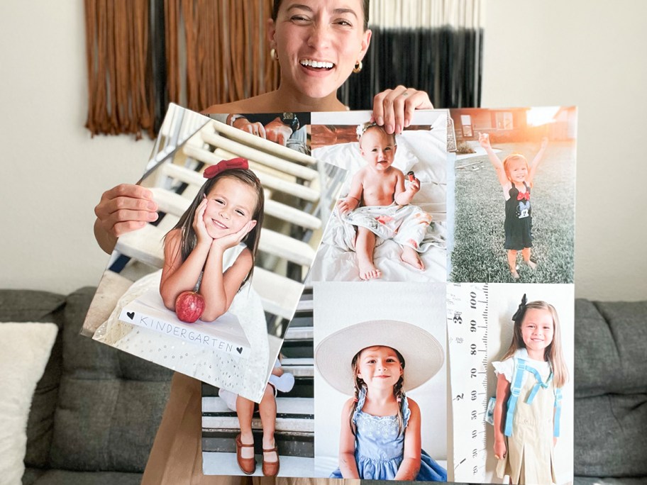 woman holding two canvas prints of children