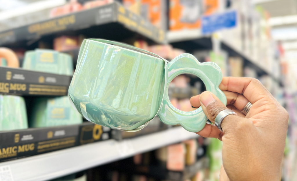holding coffee mug 