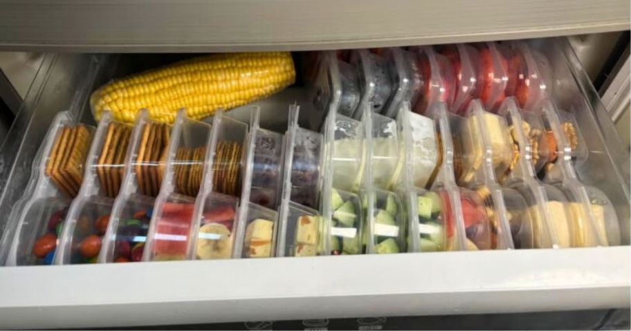 snack containers filled with food in refrigerator drawer