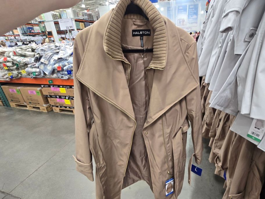 beige Halston Women's Belted Trench Coat in hand in store