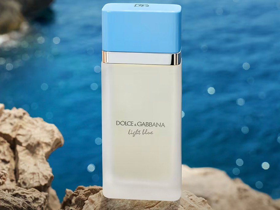 dg light blue perfume bottle near water