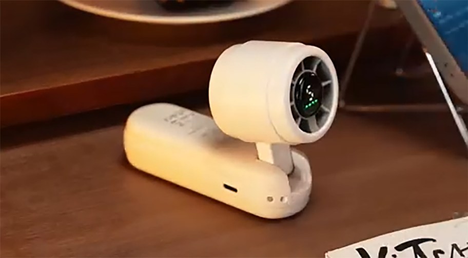 portable fan sitting on a desk
