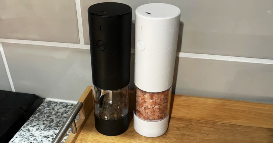 salt pepper grinders sitting on counter