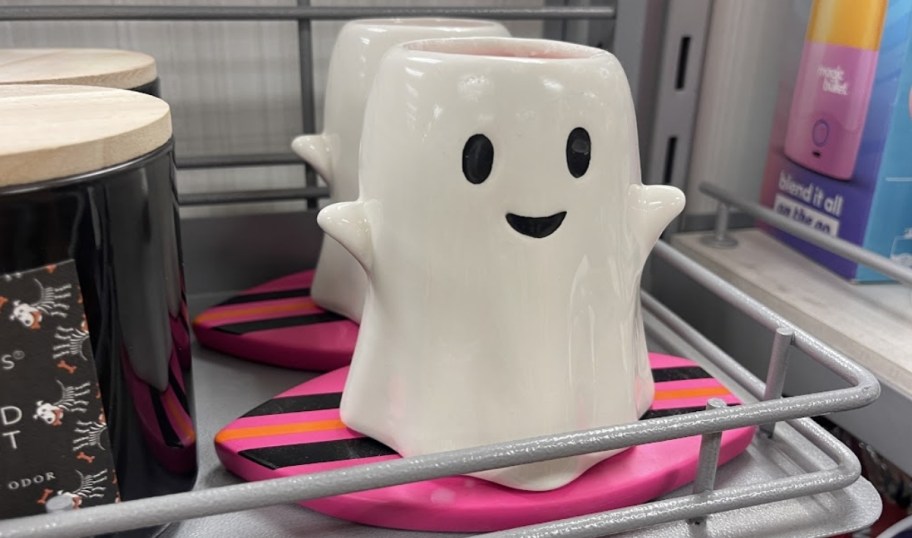 a ceramic ghost on a surf board