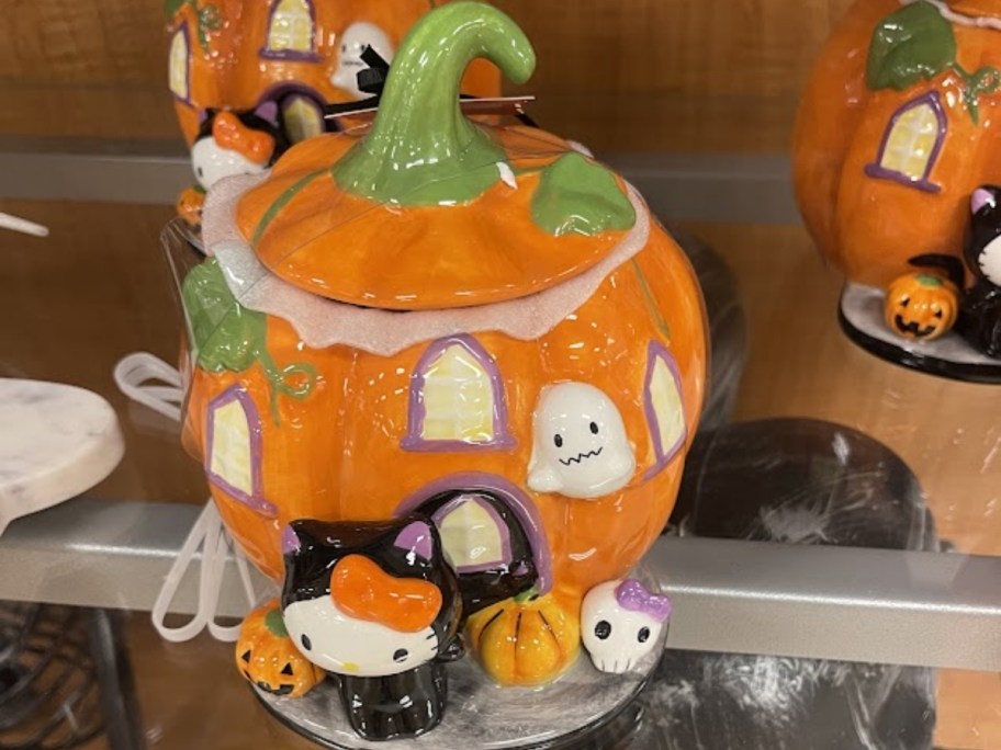 a hello kitty cookie jar on a store shelf