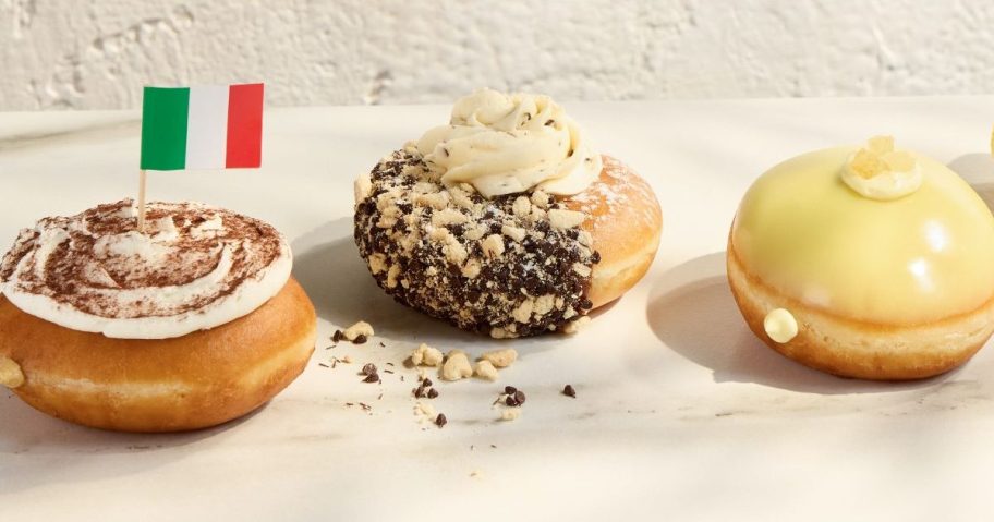 three new Krispy Kreme doughnuts displayed on top of the table
