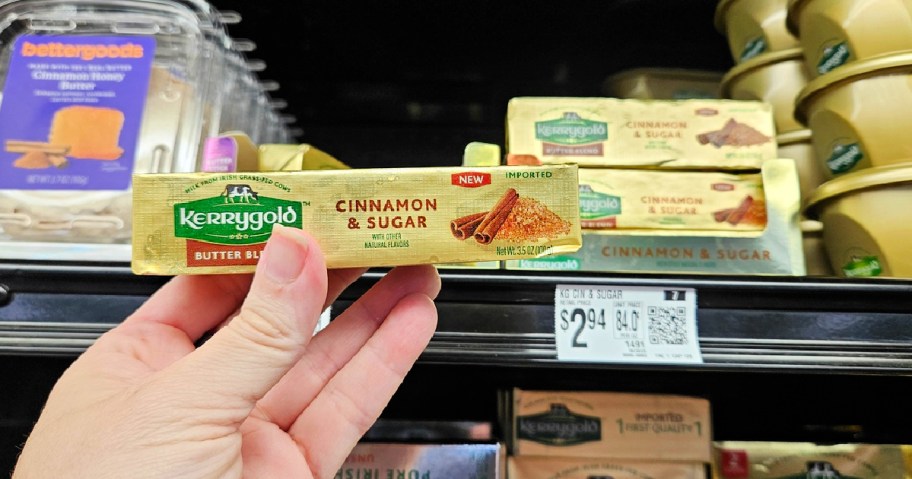 kerrygold cinnamon sugar butter stick in a woman's hand