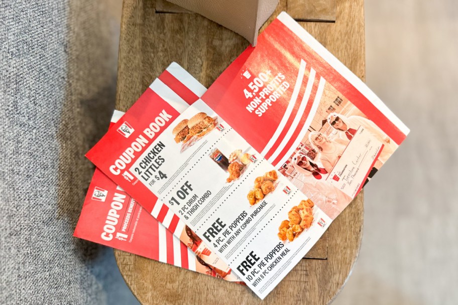 red kfc coupon booklet opened showing coupons