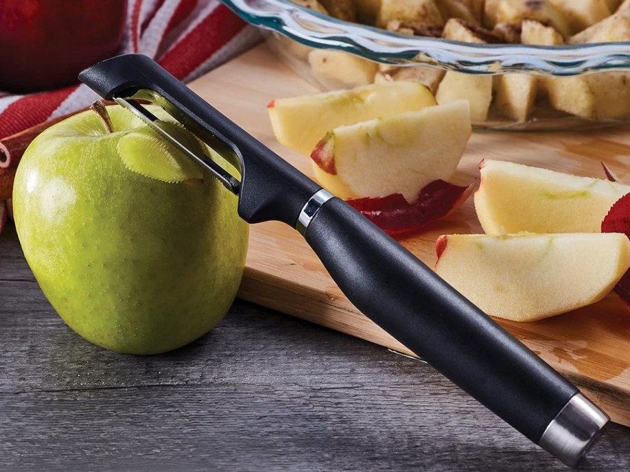 a KitchenAid peeler against an apple