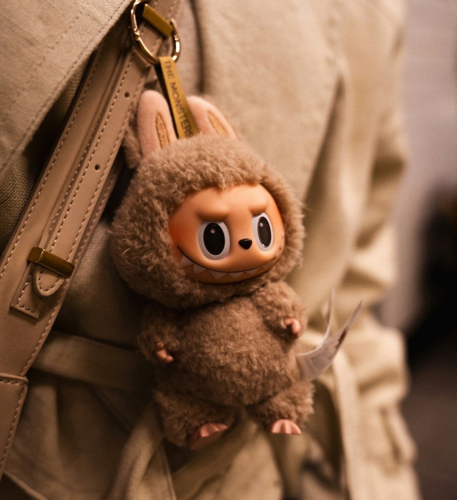 labubu keychain dangling from bookbag
