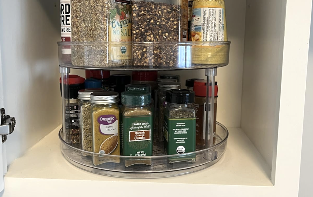 lazy susan with spices in cabinet 