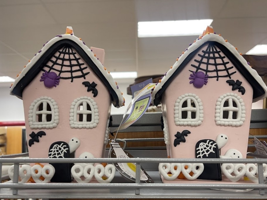 two led haunted house figurines on store shelf