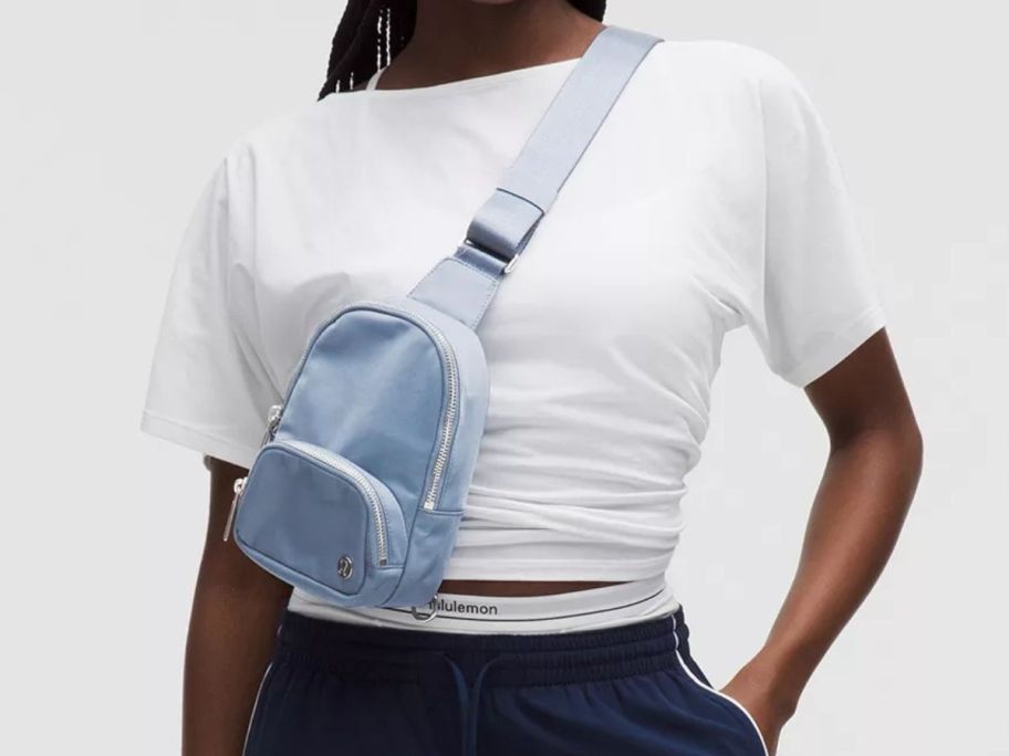 woman wearing blue lululemon Everywhere Sling Bag Small 2L