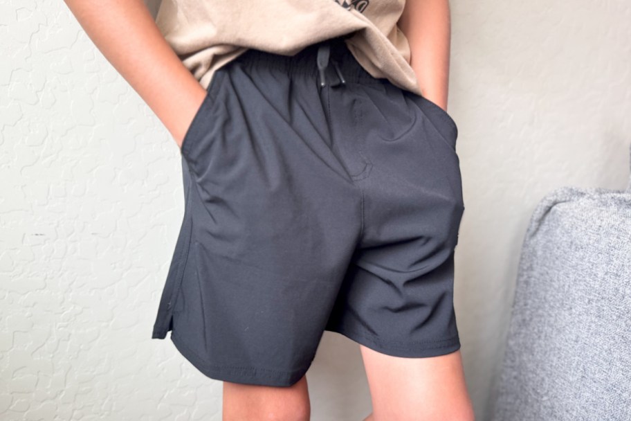 boy wearing black shorts
