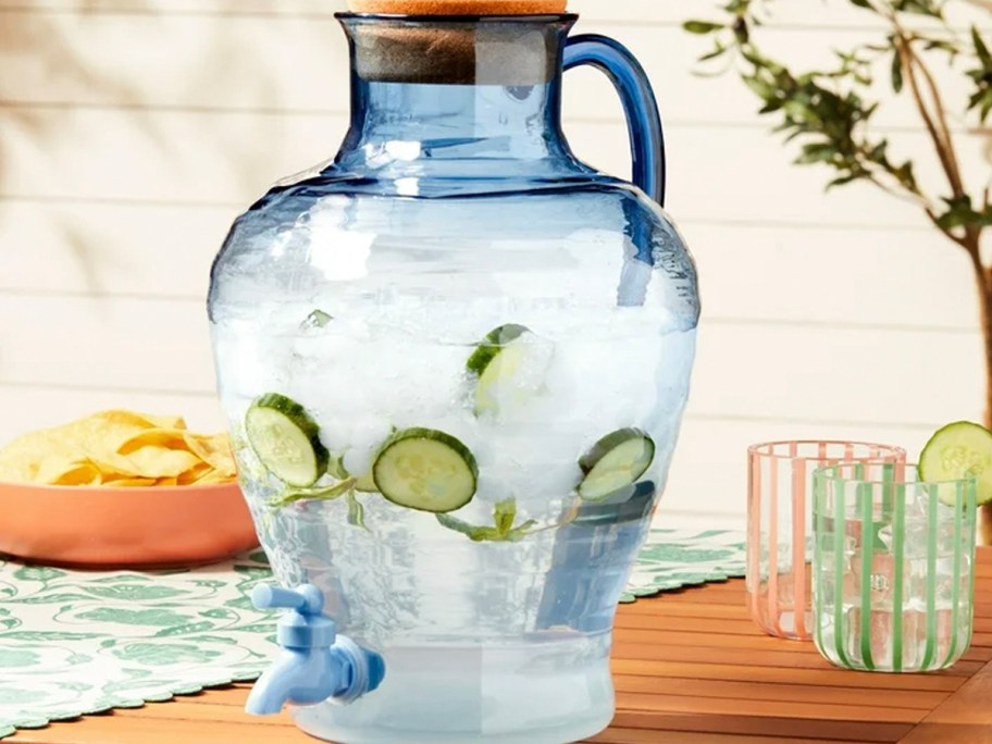 blue beverage dispenser on table 