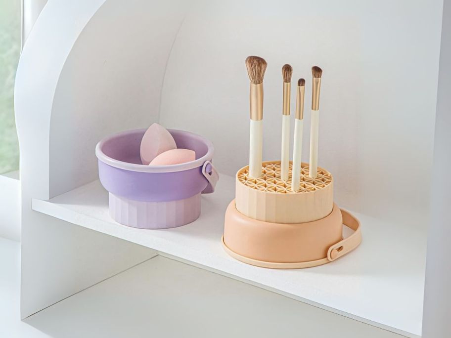 makeup brush cleaner bowl with brushes stored in it on shelf