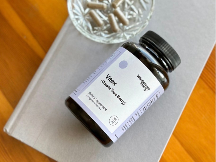 bottle of vitamins on journal