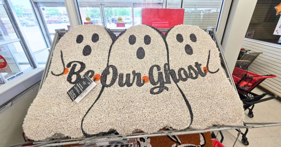 a white doormat with three ghosts on it that says be our ghost on it in cart in store