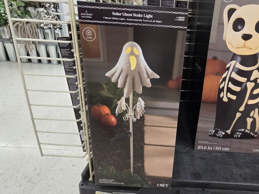 Warm White Solar Ghost Stake Light box on shelf in store