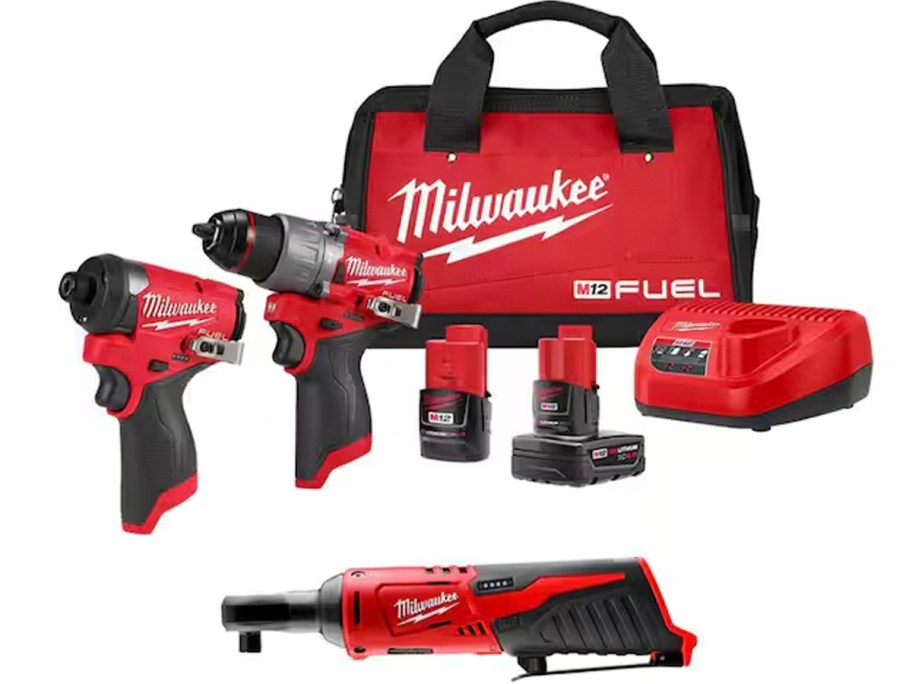 red and black milwaukee power tools, batteries and bag 