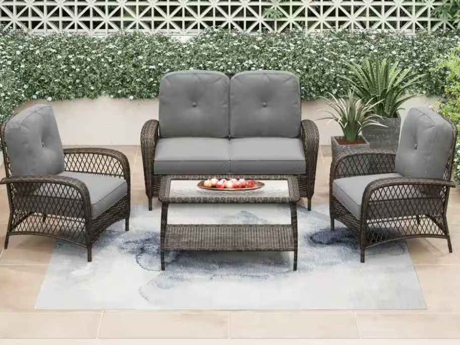 wicker patio set with gray cushions 