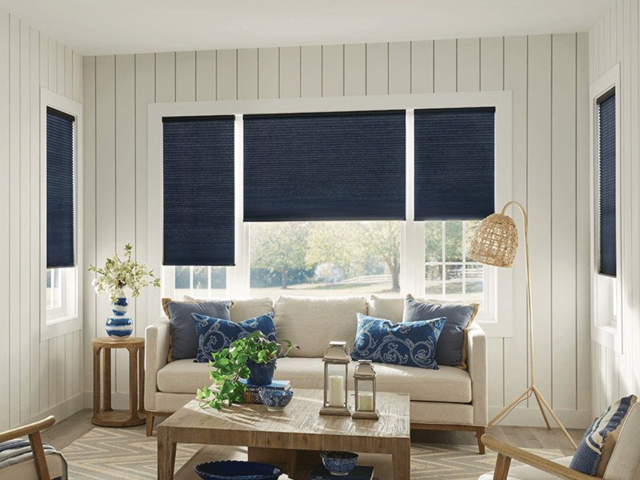 living room with navy colored blinds in different sizes