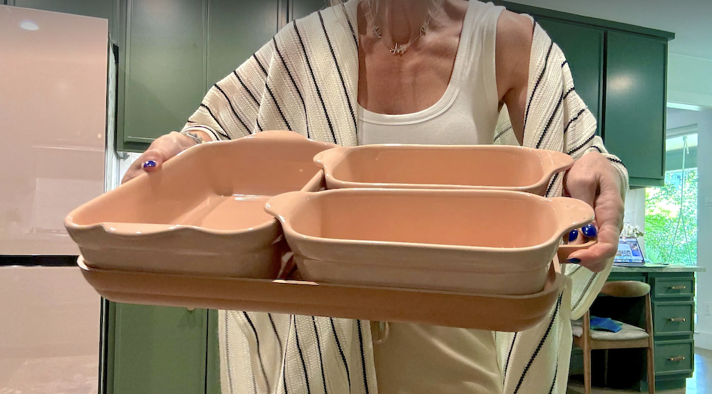 Collin holding Our Place bakeware set 