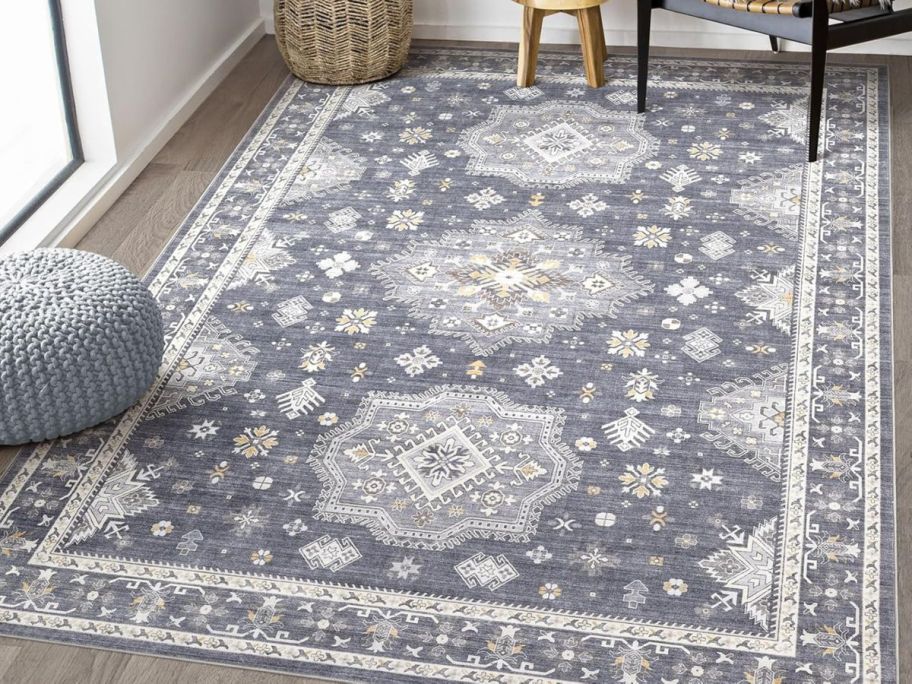 blue printed area rug in living room