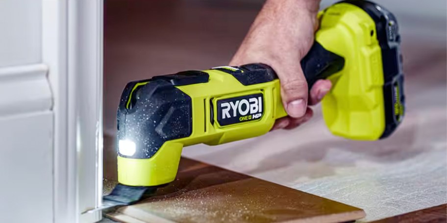 hand using ryobi tool 