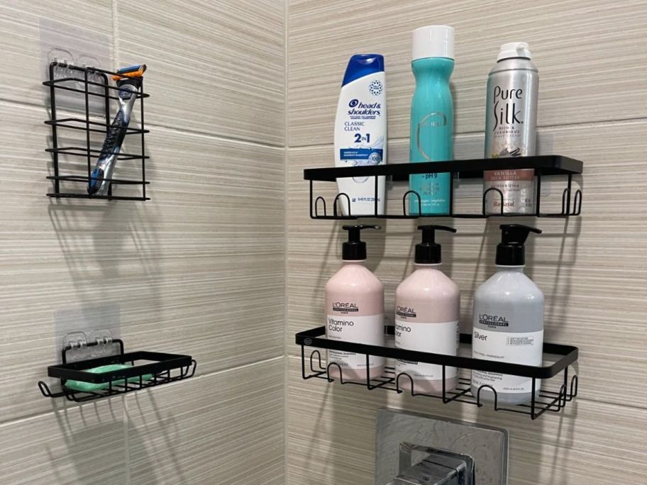 shower storage caddies on walls of shower with products in them
