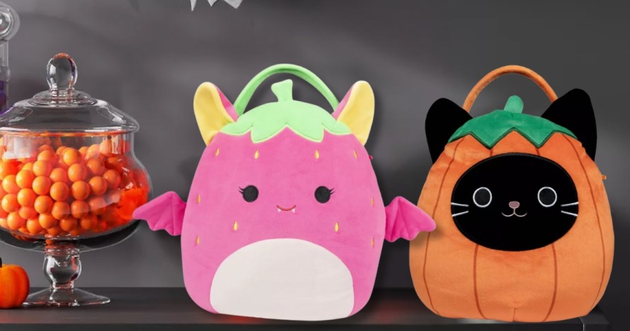 2 Squishmallows Halloween trick or treat baskets on a table with Halloween decor