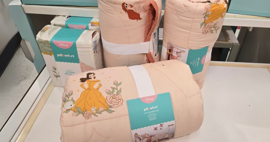 Disney Princess Quilt Sets on a shelf at Target