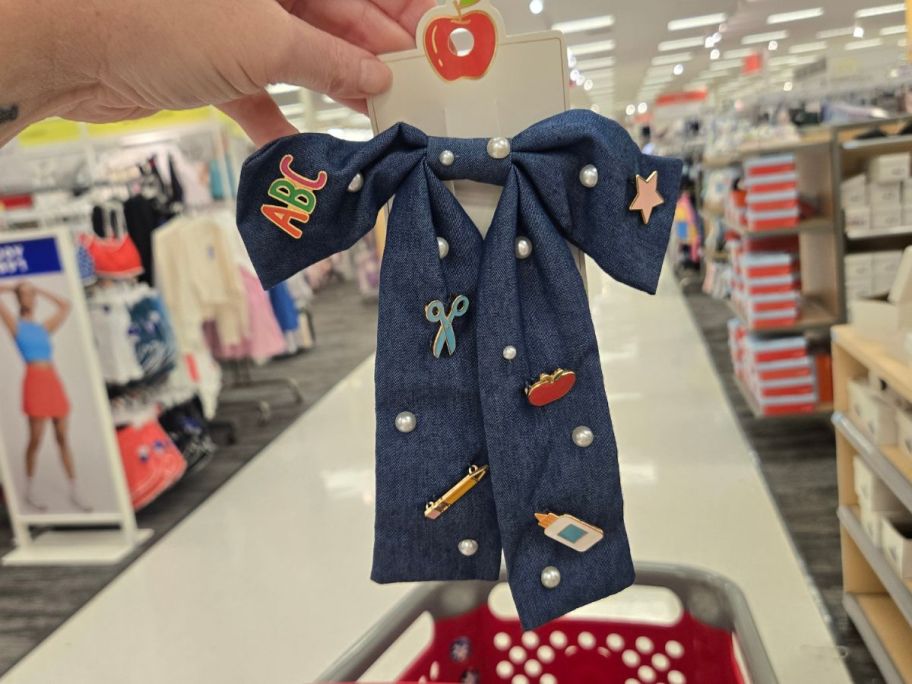 Teacher Icon Apple Pencil Glue Bottle Charm Denim Hair Bow Clip in hand in store