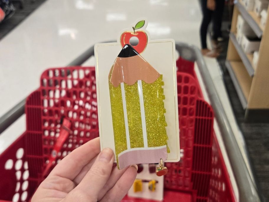 Teacher Pencil Claw Hair Clip in hand in store