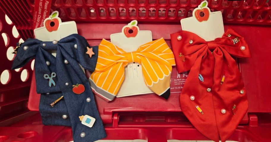 a blue, yellow, and red teacher hair bow in cart in store