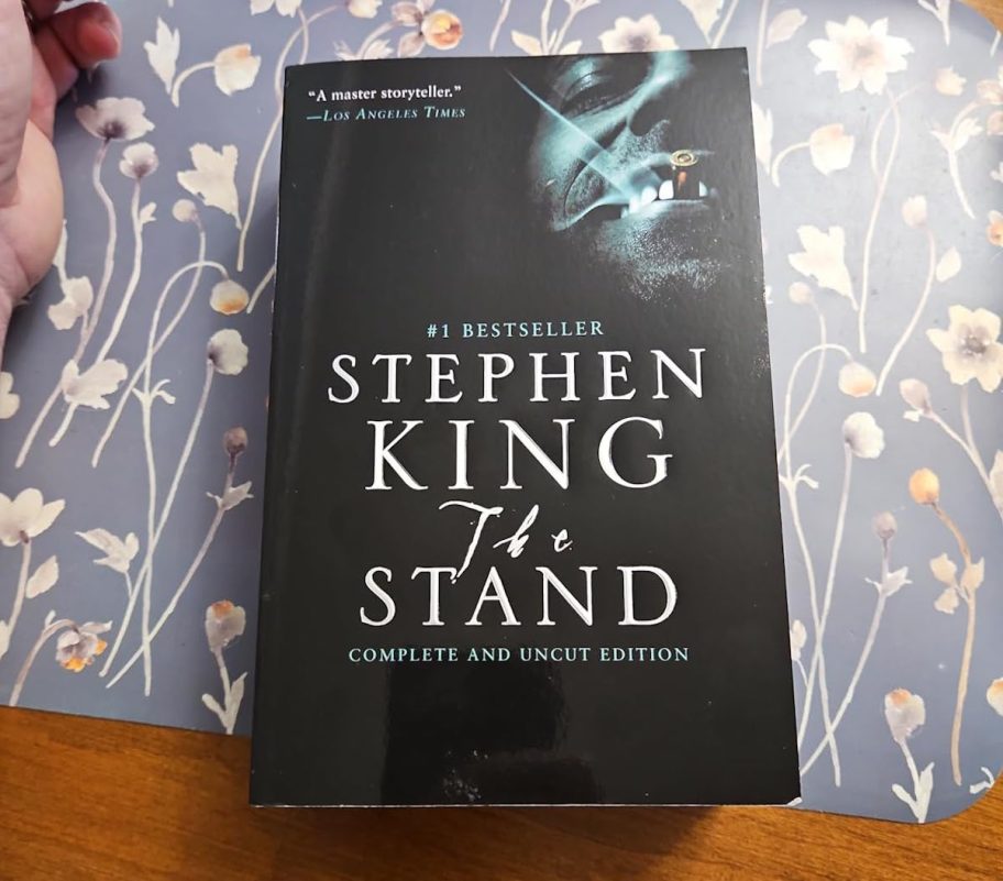 the stand by stephen king book on table