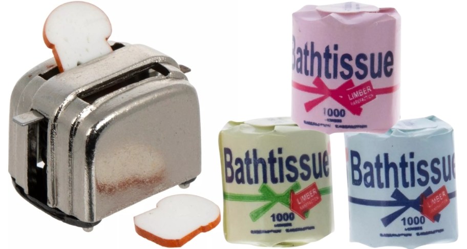 a mini toaster shown with 3 mini rolls of toilet paper