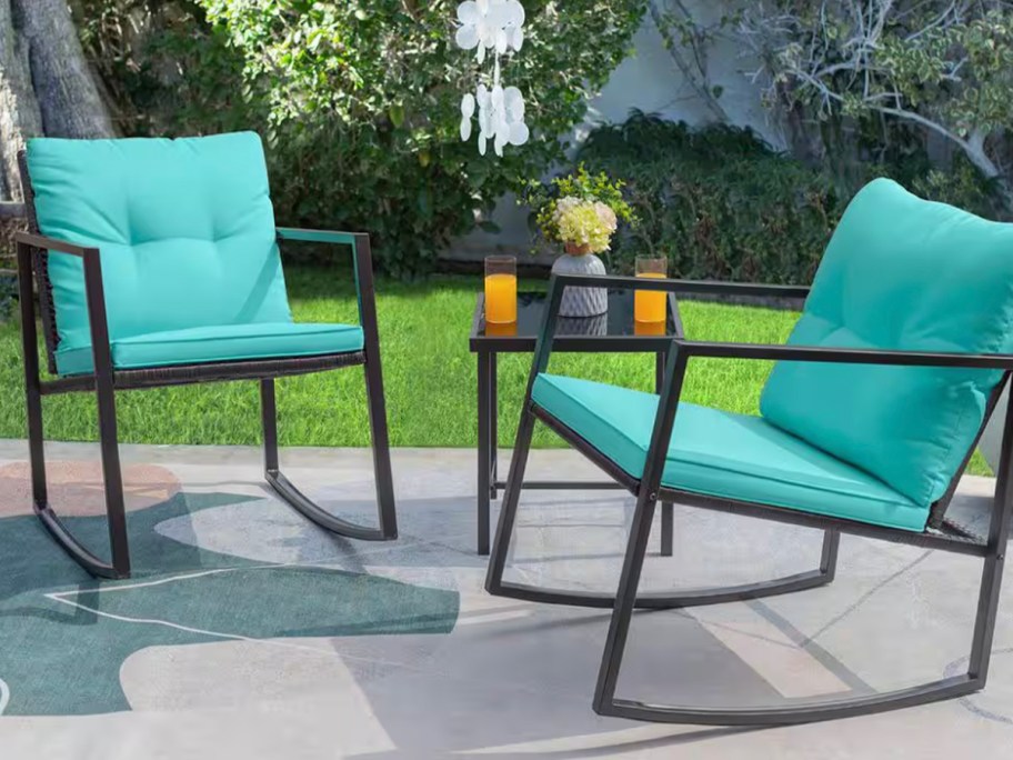 blue and black rocking patio chairs with table
