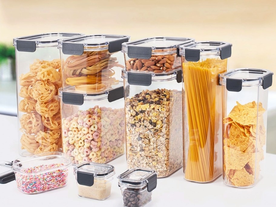 a set of clear pantry storage containers filled with dry foods