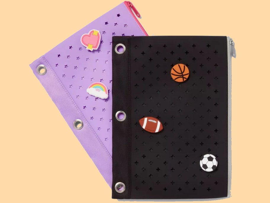 purple and black binder pencil pouches with charms on them