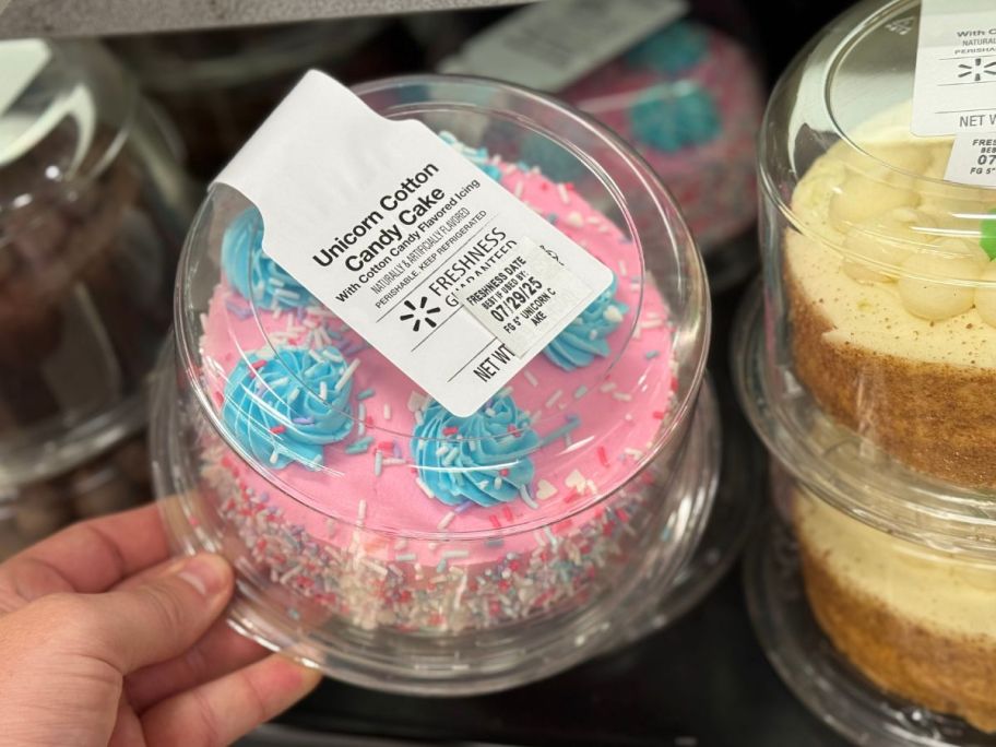 5" Unicorn Cotton Candy Cake in package in hand in store