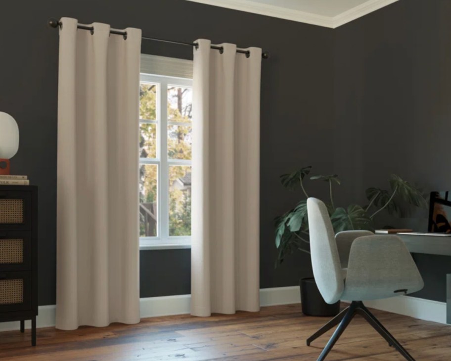 beige curtains in room with dark walls