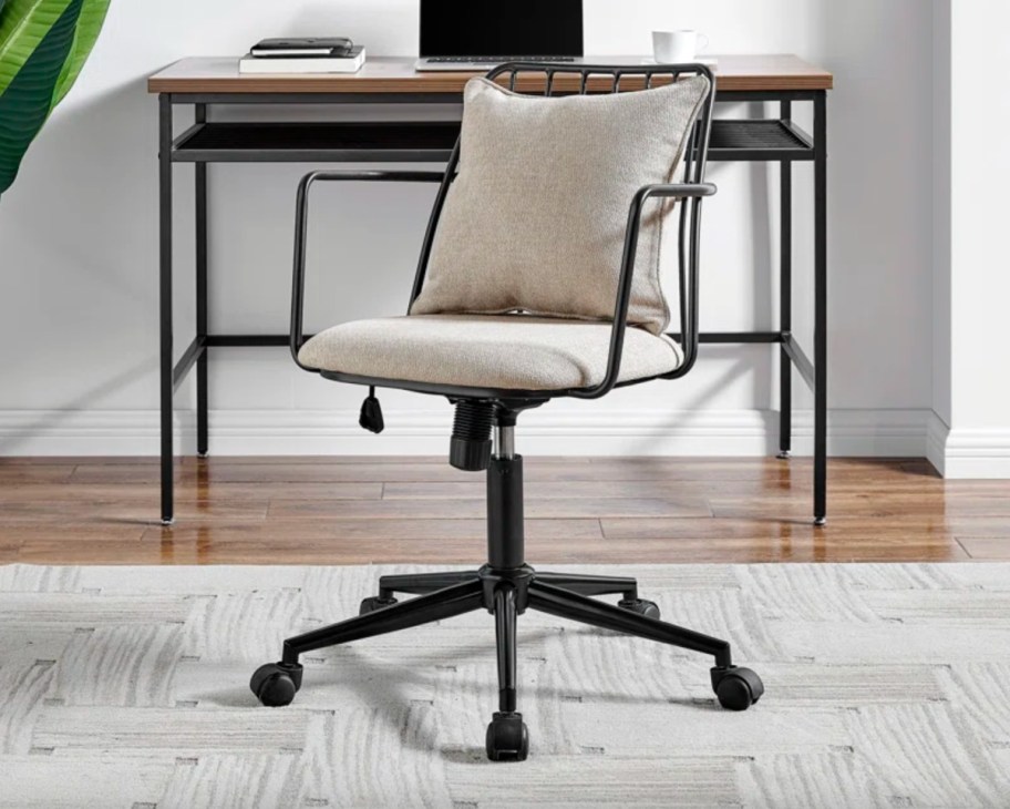 beige and black metal conference chair
