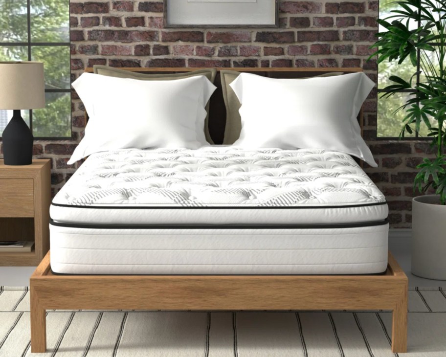 white pillowtop mattress on brown bed frame