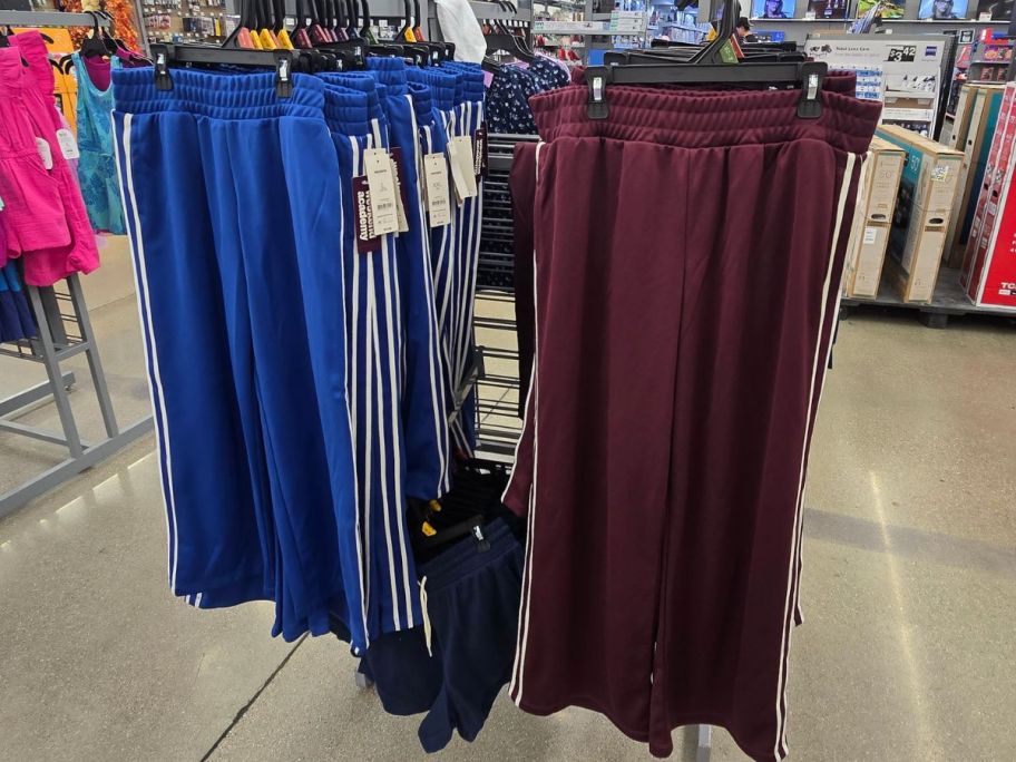 blue and burgundy Weekend Academy Boys Track Pants on rack in store
