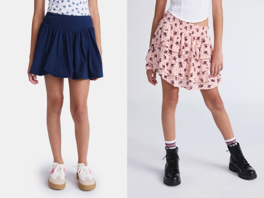 two girls wearing a weekend academy blue skort and a pink patterned skirt