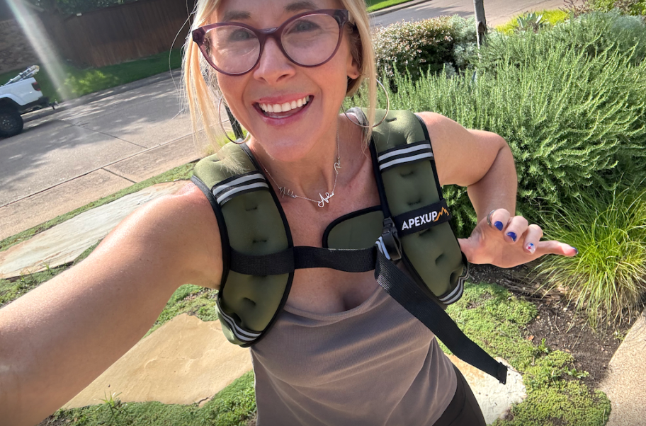 woman wearing green weighted vest while out walking